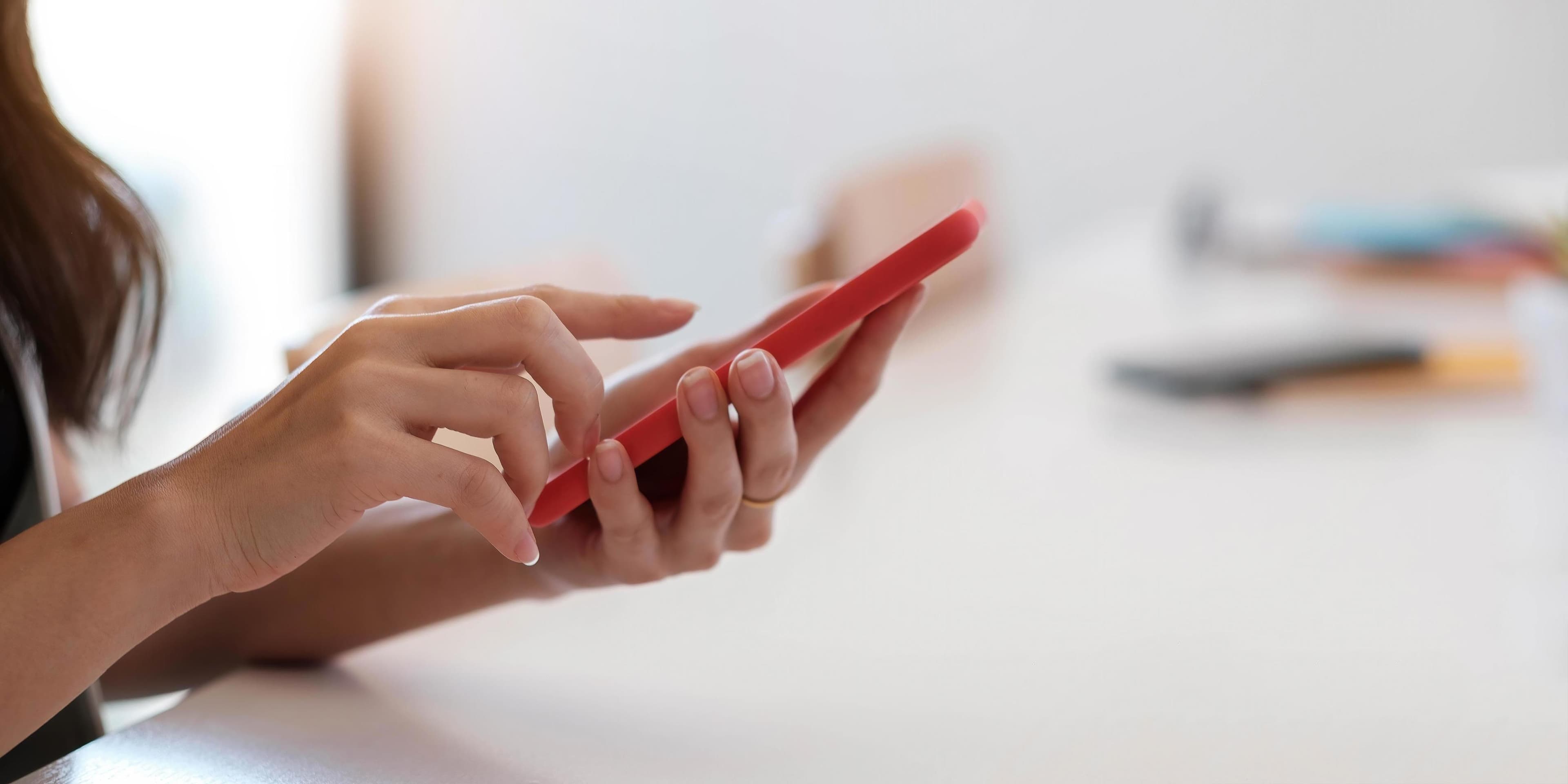 Person using a smartphone to prepare contractor quotes and invoices