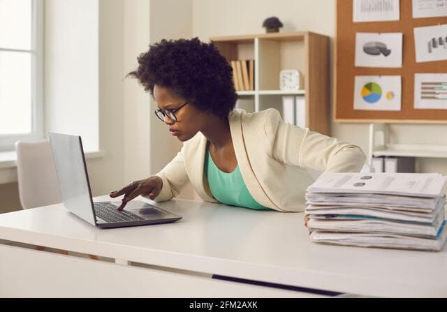 Freelancer working on invoice administration from a laptop
